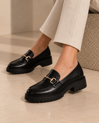 LOECY black Buckle Loafers worn with cream trousers, chunky buckle loafers